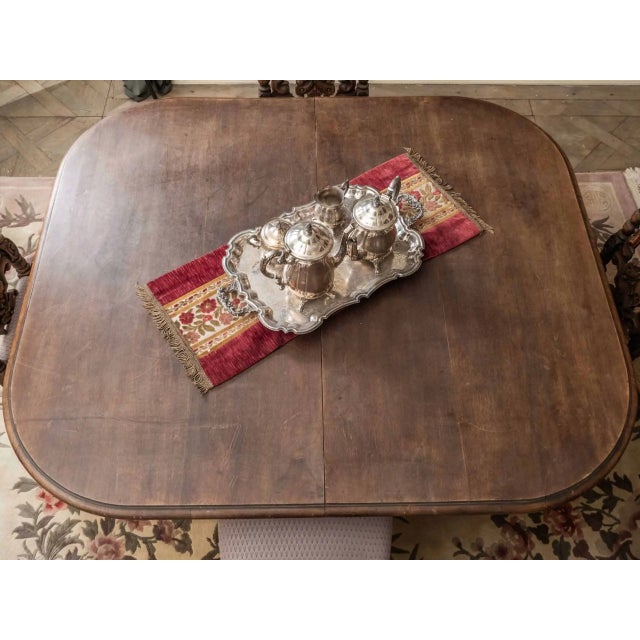 Dining table made of solid walnut in the Renaissance style of Henry II. The table has a richly turned base with oblique...