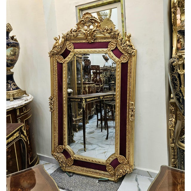 Elevate your interior with this stunning French Baroque-style wall mirror, featuring an elaborate frame finished in...