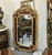Elevate your interior with this stunning French Baroque-style wall mirror, featuring an elaborate frame finished in...