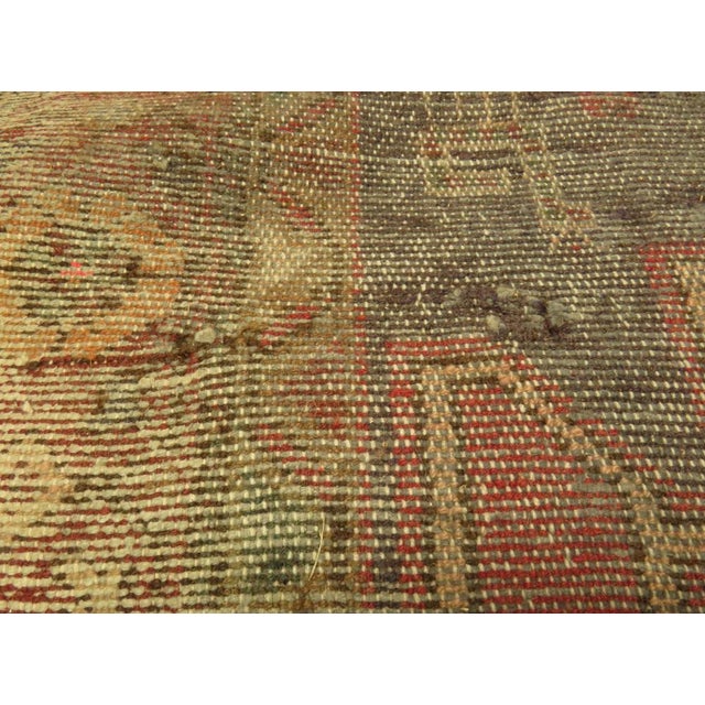 A beautiful traditional Turkish rug dating to the mid 20th century. It is hand woven from wool and features traditional...