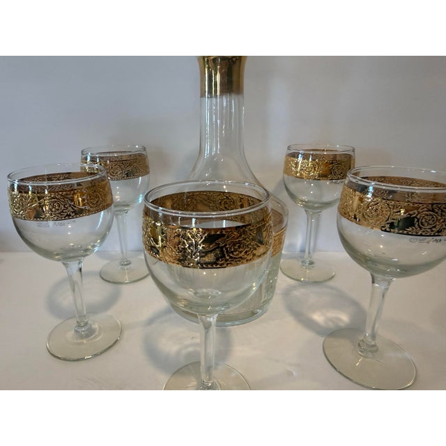 This exquisite vintage mid-century barware collection is a 6-piece glass-only set consisting of one liquor decanter and...