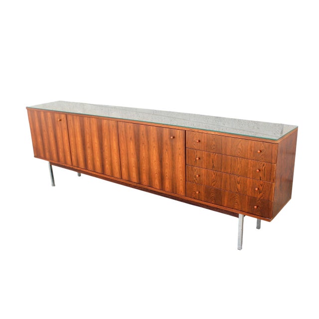 The wonderful danish mid-century rosewood sideboard was manufactured in the 1960s. This rare, minimalist credenza features...
