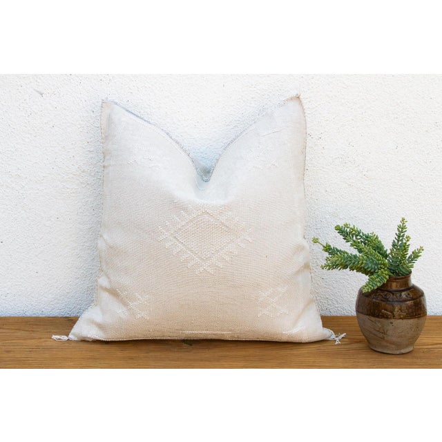 Indulge in the quiet beauty of this handcrafted Moroccan cactus silk pillow, measuring a generous 24 inches square. Woven...