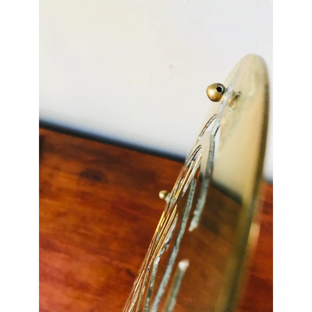 Both trivets bear the Chinese Shou symbol of longevity. These can also be hung on the wall. One foot of each (on the back)...