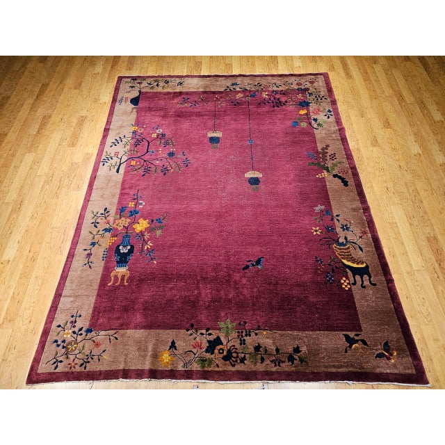 A stunning example of early 20th century Chinese artistry, this vintage hand-knotted Art Deco rug features an exquisite...