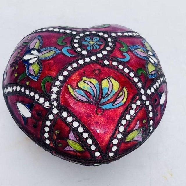 This is a charming vintage cloisonné enamel heart-shaped trinket box, attributed to the "export creation" period of the...