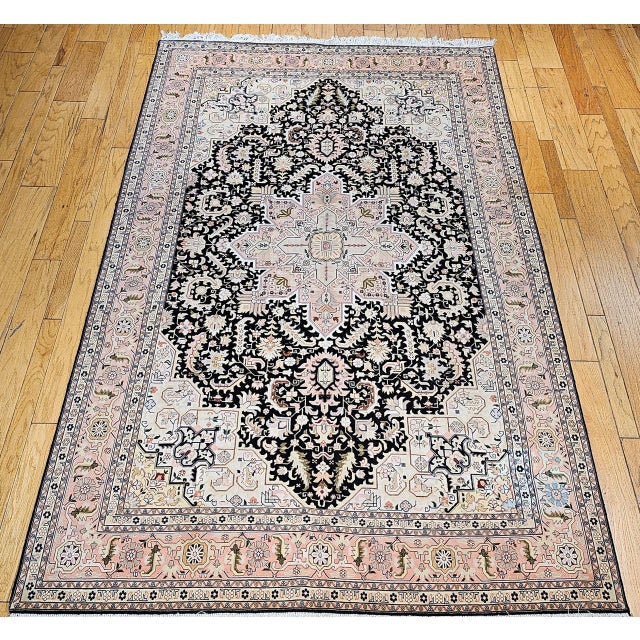 "This fine Persian Tabriz rug is a rare masterpiece that beautifully captures the spirit of classic Heriz village rugs...