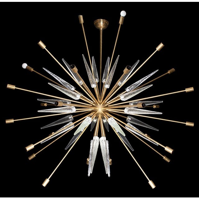 Modern Sputnik lamp. A brass rod with a hemispherical upper end serves as a support for a sphere to which numerous...