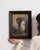 This early 20th century painting from France is an oil on panel, housed in a wood frame. It is distinguished by its...