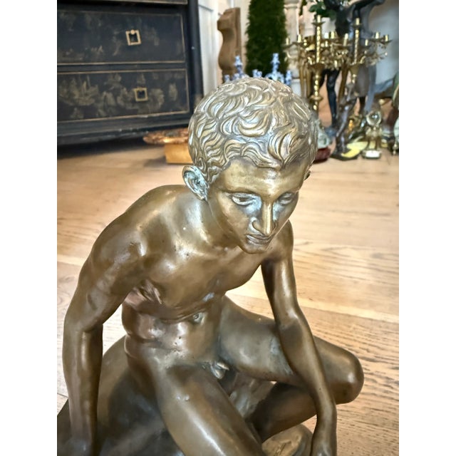The antique seated figure of Hermes, often referred to as Mercury in Roman mythology, attributed to the foundry of...