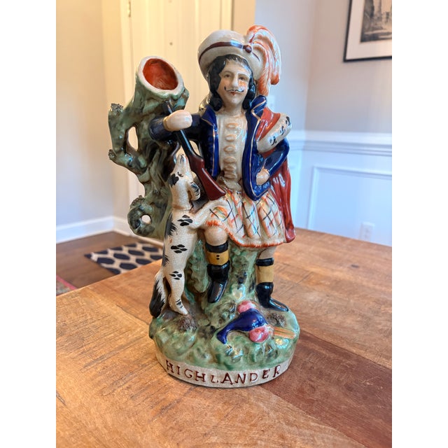 Scottish male figure with his hunting dog and gun. Highlander spelled across base. Possibly from the 1970’s. Perfect...