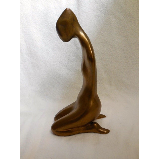 Girl Seated a la Japonaise, 1964, polished bronze. It was exhibited at The Chapman Gallery NYC in 1968. Cast at Morris...