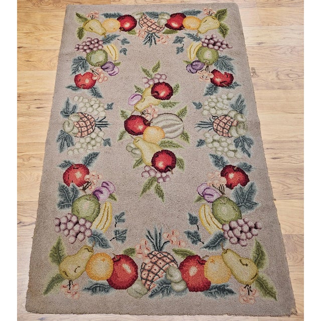 Vintage American hand hooked area rug in a fruit pattern circa the early 20th century. The very unique and beautiful...