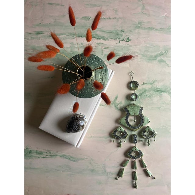 This is an exceptional sage green handmade wall sculpture designed by Finnish modernist Maija-Liisa Vasenius for Kalevala...