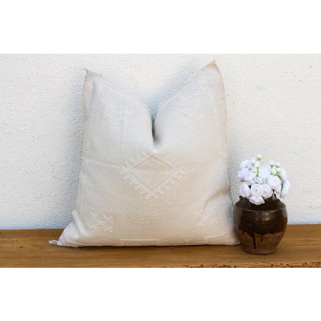 Indulge in the quiet beauty of this handcrafted Moroccan cactus silk pillow, measuring a generous 24 inches square. Woven...