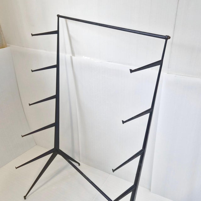 Fair condition. General wear, paint is peeling. Slight bend on one side. The shelf can be completely disassembled into two...