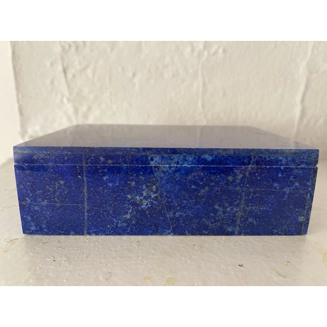 Lapis lazuli hand carved mosaic lidded box, with white marble interior. Natural lapis stone has beautiful golden pyrite...