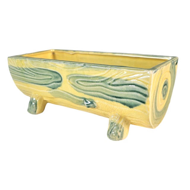 This mid-century ceramic planter reflects the playful sculptural forms popular in Japanese export pottery of the 1950s....