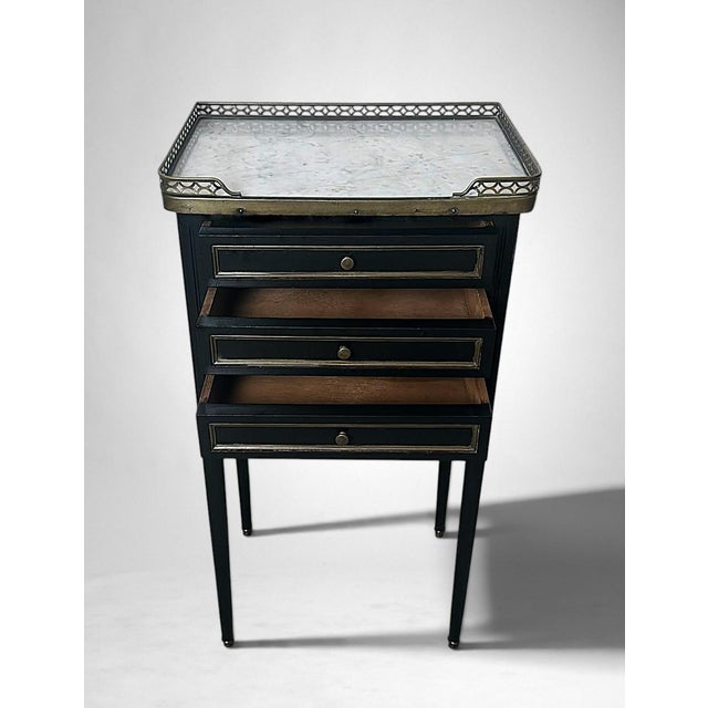 This elegant and understated French bedside table, crafted in the Napoleon III style, is distinguished by its harmonious...