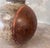 Vintage glazed ceramic tsubo-style vessel featuring a rounded sculptural form and richly textured earthy brown glaze. An...