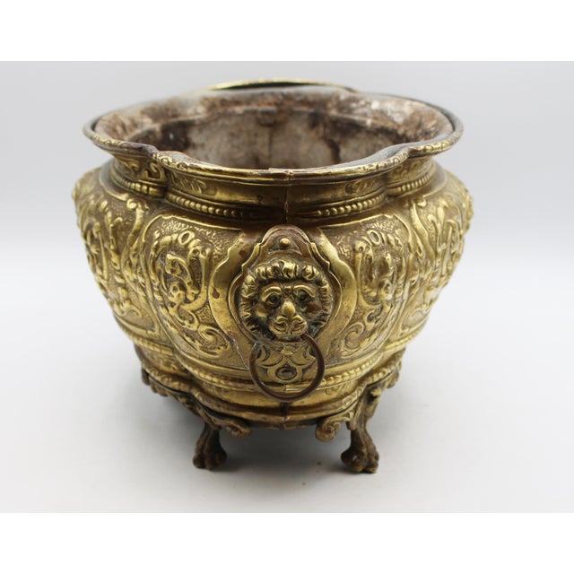 Circa 1860-80 Anglo-French lobed oval brass planter. Retains the original (somewhat bent from use) liner. The repousse...