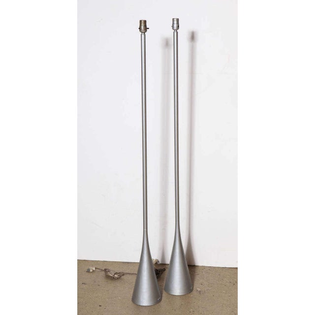 Pair of French Modern Pascal Mourgue for Ligne Roset cast aluminum bedside, reading floor lamps. Featuring a sleek, all...