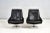 Pair black leather lounge chairs on stainless steel and Calacatta marble bases, circa 1970’s. Very good original condition.