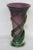 This lovely Vase is made out of hand blown glass. This unique vase features a purple and green color wrapped around the...