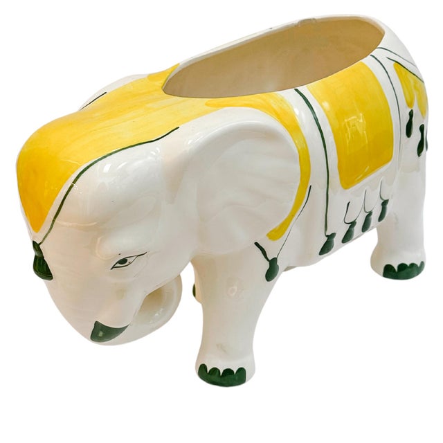 Large vintage porcelain elephant planter hand-decorated in a bright retro Hollywood Regency yellow and green design. Mouth...