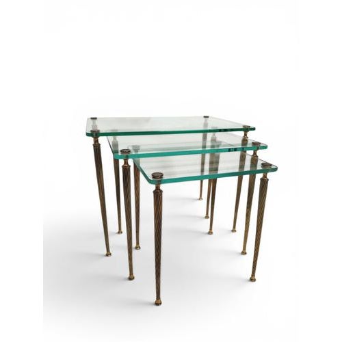 Elevate your living space with this exquisite Maison Bagues nest of tables, a true testament to timeless elegance and...