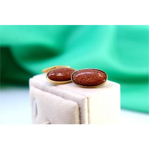 Gold cufflinks with oval brown stone. Metal: Gold. Origin: Portuguese. Brand: Veado. Weight: 9.37 grams. Dimensions: 2 cm...