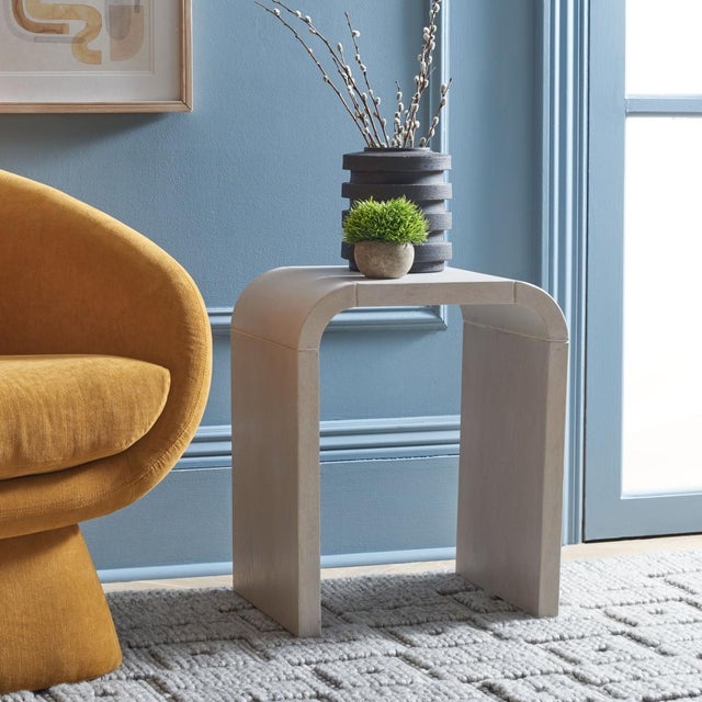 Introducing the LiaSonya Curved Accent Table in a stunning white washed finish. Crafted from the charming combination of...