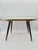 An original mid-century modern coffee table, made in Europe in the 1960s. Its simple, timeless form is combined with a...