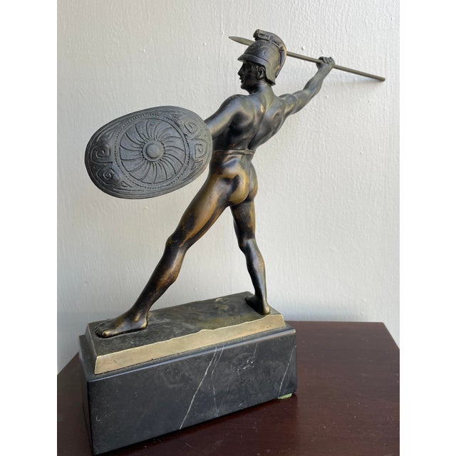 Early 20th century bronze sculpture of a spear throwing Roman or Greek soldier by A. Zierhut (sometimes known as Kierhut)....
