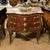 Make a statement with this magnificent French bombe commode, showcasing exceptional floral marquetry, graceful serpentine...