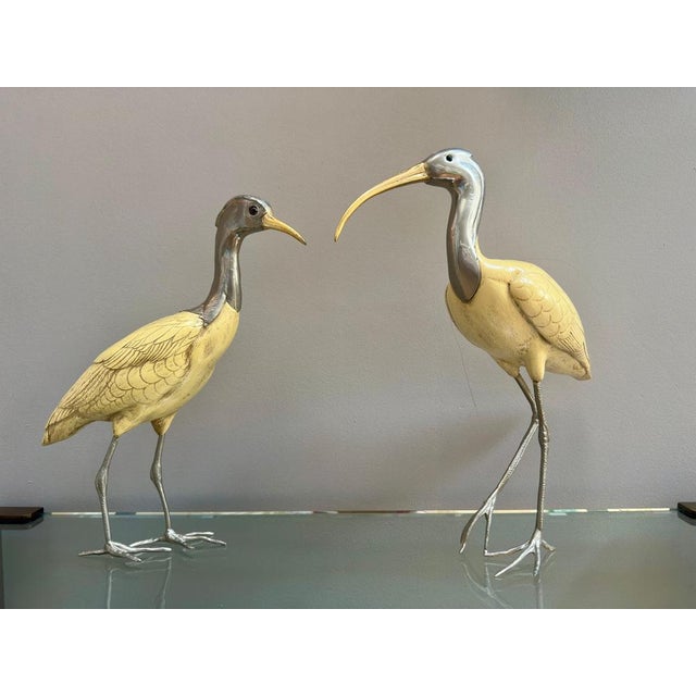 A pair of Ibis birds by Italian designer Elli Malevolti circa 1950. The bodies in resin with silver plated heads, feet and...