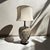 A striking 1969 Mid-Century Modern ceramic table lamp by Quartite Creative Corp., featuring a sculptural ovoid form with a...