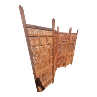 Vintage Hand-Carved Wooden Four-Panel Folding Room Divider Screen With Intricate Floral and Geometric Fretwork For Sale