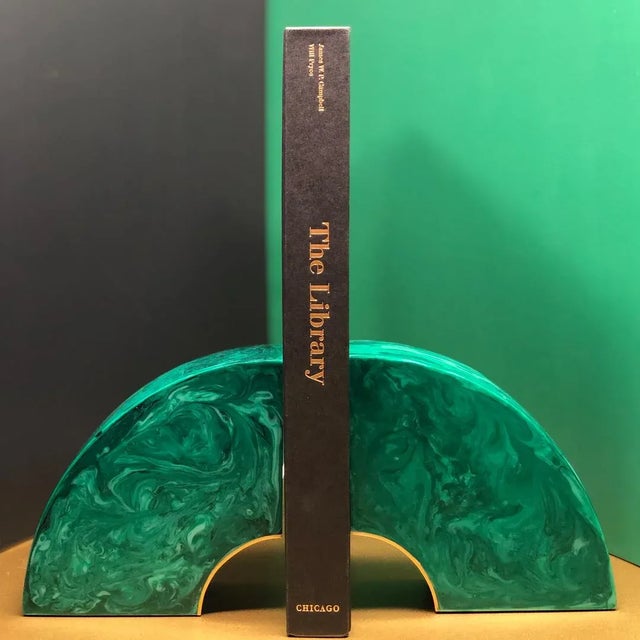 Arch shaped bookends in malachite finished resin with brass detailing. These are handmade and in new, perfect condition....