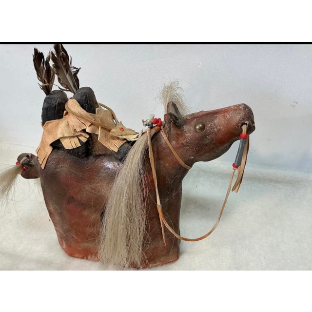 An original signed mixed-media horse sculpture by Blackfeet artist Farrell Cockrum, showcasing the artist’s distinctive...