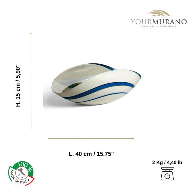 Murano glass bowl with the distinctive shell shape. This handcrafted glass centerpiece comes in ivory with a blue spiral...
