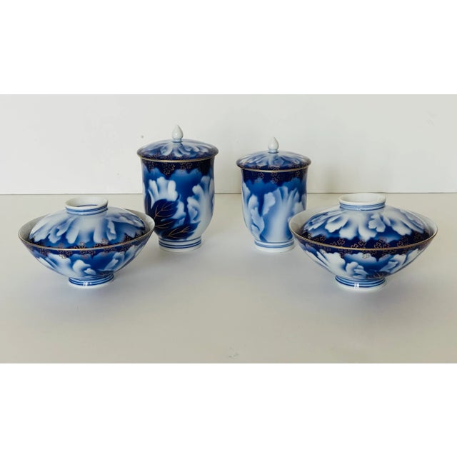 Splendid vintage Japanese Fine porcelain cobalt blue with gold Handpainted tea set . 4 cups with covers. Underglaze sign.
