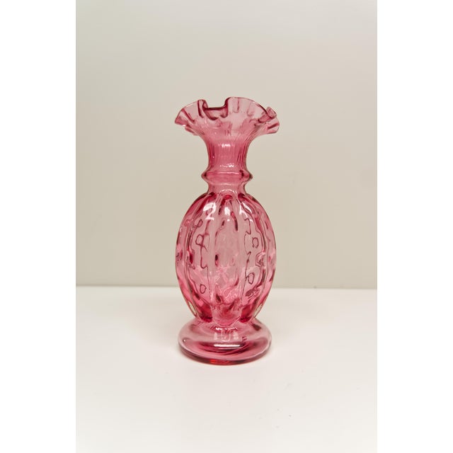 A Fenton Diamond Optic cranberry glass vase showcases the timeless craftsmanship the brand is known for. Its rich...