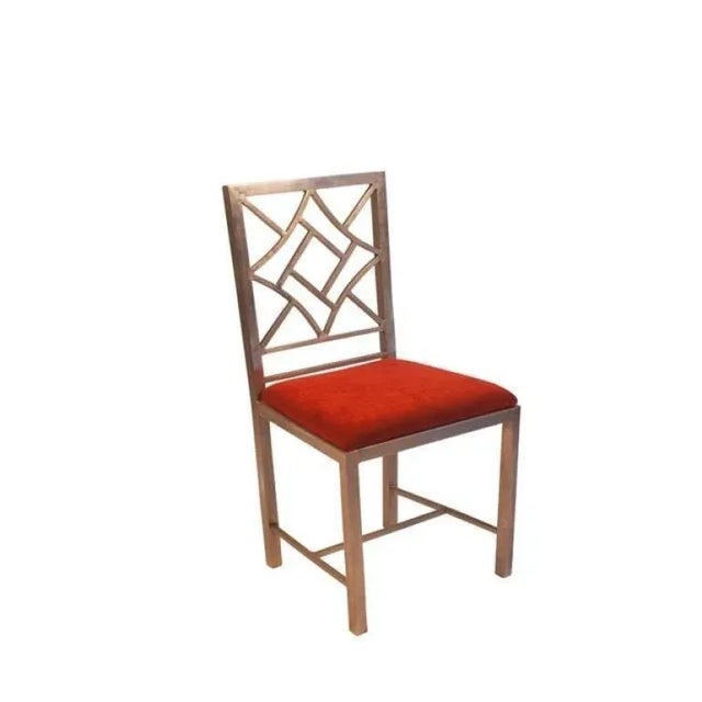A modern take on a classic design, a steel Chinese Chippendale–style side chair. Seat height 20".