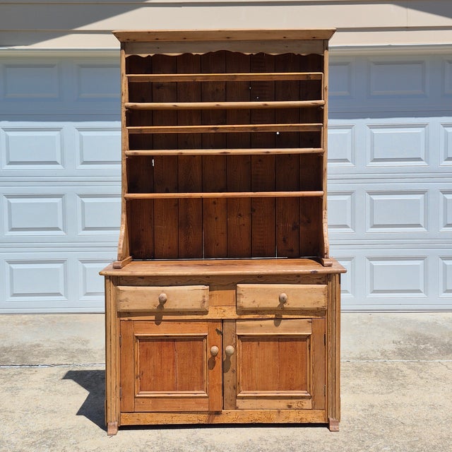 This is an immensely charming English scrubbed pine hutch or Welsh dresser, circa 1890s. The 2-piece cupboard measures...