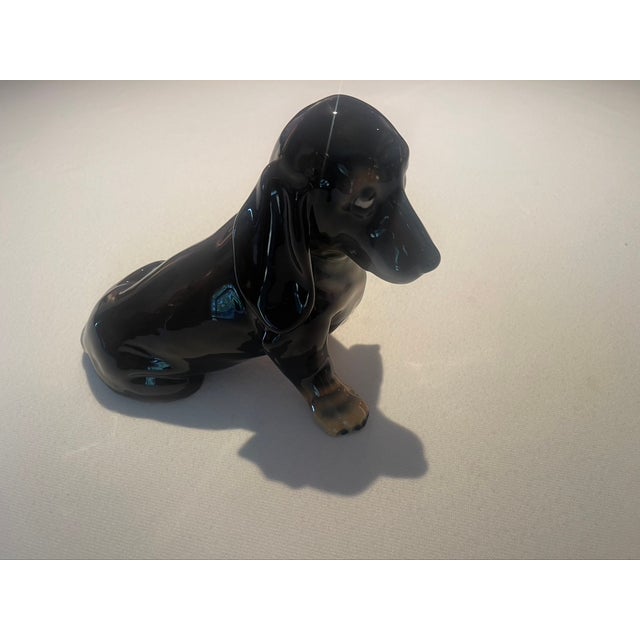 This vintage 1950's lifelike dachshund figurine is meticulously crafted by Keramos, Vienna, Austria. It is signed and in...