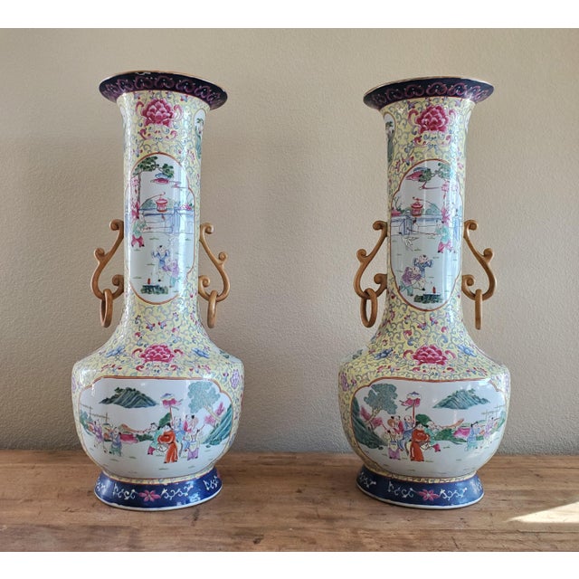 Large Rare Pair of Chinese Famille Rose vases Qing Dynasty 19th Century Each with applied gold handles holding rings,...