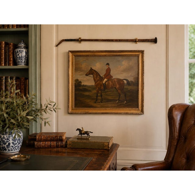 An early 20th-century equestrian riding crop or horse whip, hand wrapped in richly aged brown leather. Its long, slender...