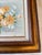 1960s small painting of flowers in a wood frames. a vibrant still life bouquet of yellow and orange flowers against a...