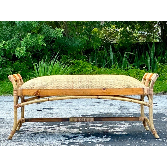 Enhance your coastal retreat with this Vintage Coastal Woven Rattan Bench. The expertly woven rattan frame exudes a...